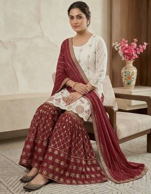 Heavy work white top with red sharara suit with dupatta 3