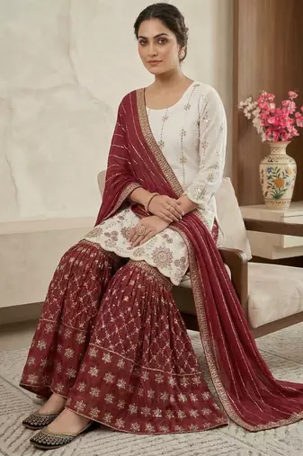 Heavy work white top with red sharara suit with dupatta