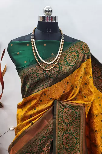 Yellow green silk blend banarasi saree with unstitched blouse piece