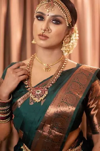 Green silk blend banarasi saree with unstitched blouse piece