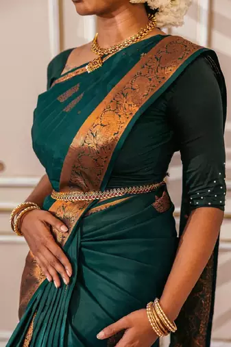 Green silk blend banarasi saree with unstitched blouse piece