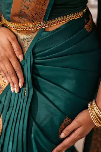 Green silk blend banarasi saree with unstitched blouse piece