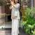 Women's silk sequin embroidered white v-neck kurta with silk sharara set