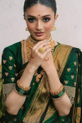 Green silk blend banarasi saree with unstitched blouse piece