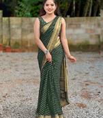 Green silk blend banarasi saree with unstitched blouse piece