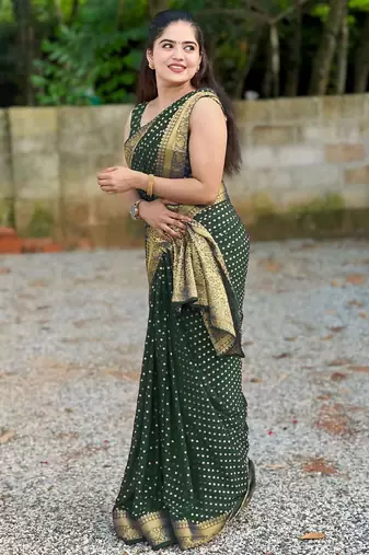 Green silk blend banarasi saree with unstitched blouse piece