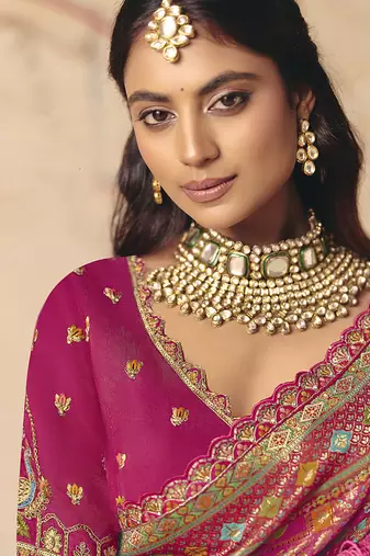Rani pink embroidered silk blend saree
