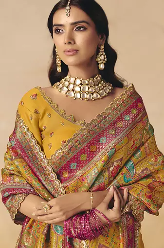 Mustard embroidered silk blend saree
