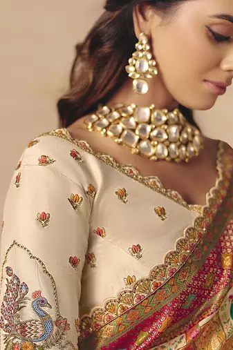 Cream embroidered silk blend saree