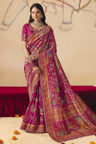 Rani pink embroidered silk blend saree