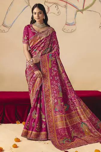 Rani pink embroidered silk blend saree