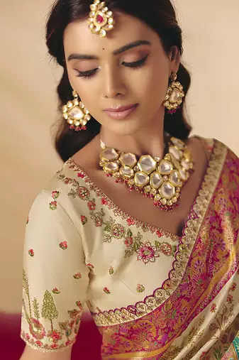 Cream embroidered silk blend saree
