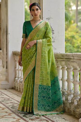 Green soft silk pochampally ikkat weaving saree with contrast blouse piece