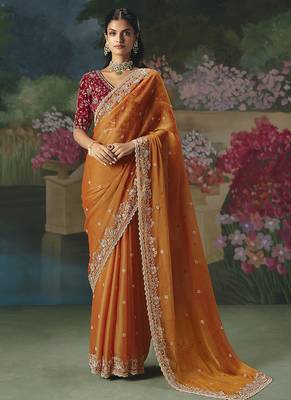 Fancy fabric embroidered saree in orange 1