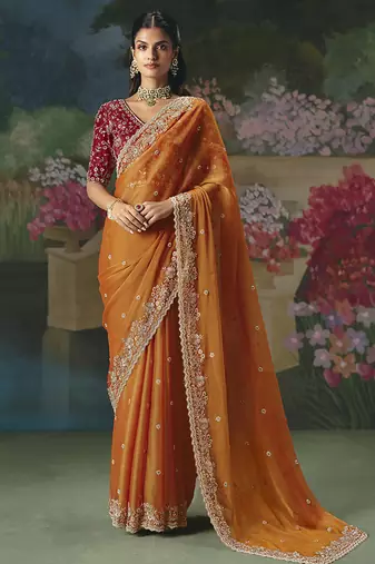 Fancy fabric embroidered saree in orange