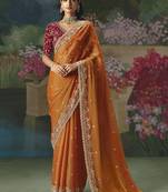 Fancy fabric embroidered saree in orange