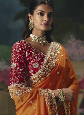 Fancy fabric embroidered saree in orange 2