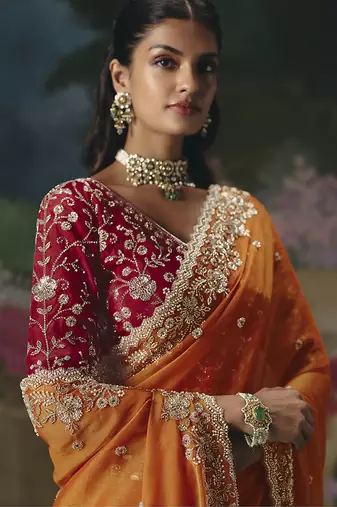 Fancy fabric embroidered saree in orange