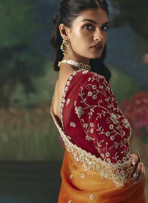 Fancy fabric embroidered saree in orange 3