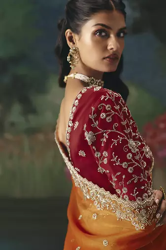 Fancy fabric embroidered saree in orange