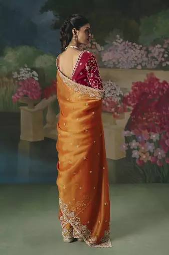 Fancy fabric embroidered saree in orange
