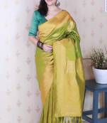 Green banarasi silk leheriya zari woven saree with contrast blouse piece