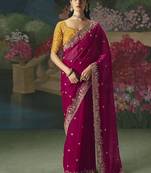 Fancy fabric embroidered saree in rani pink