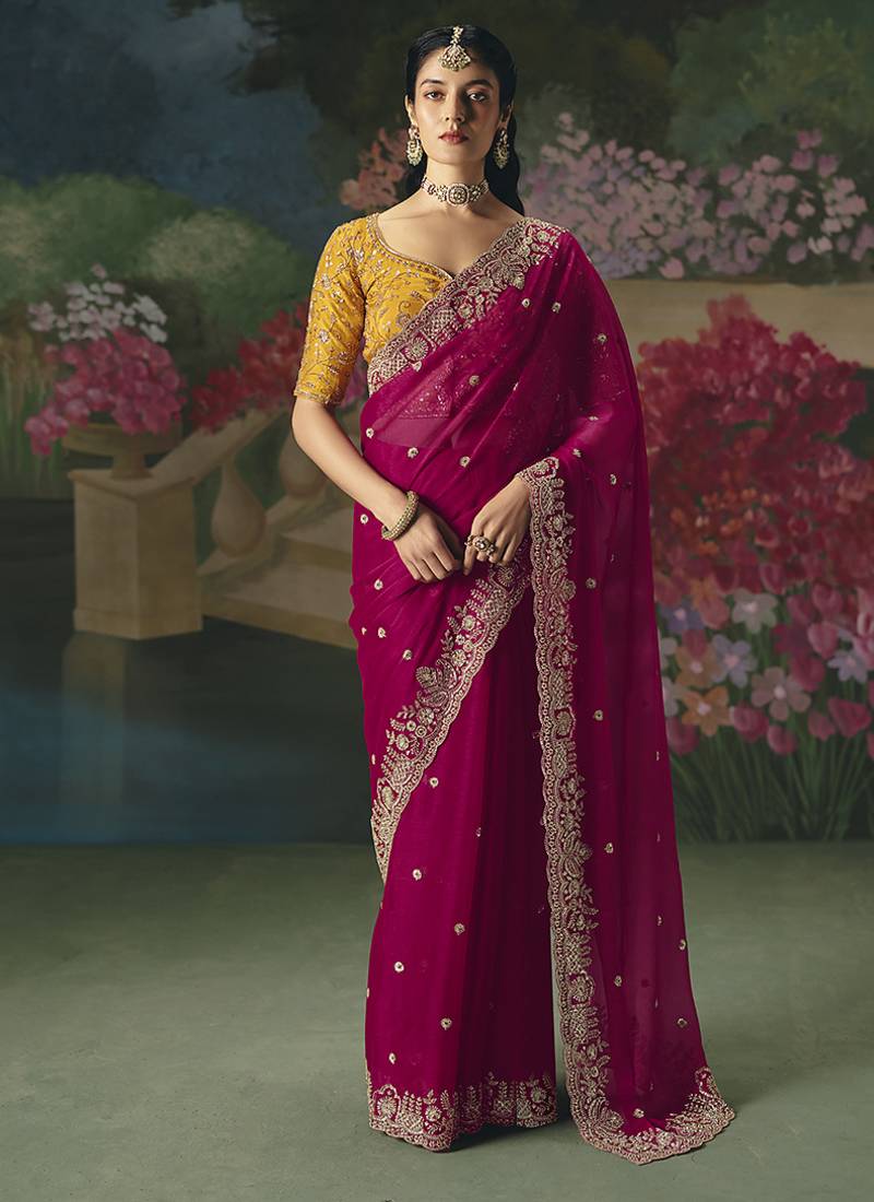 Fancy fabric embroidered saree in rani pink