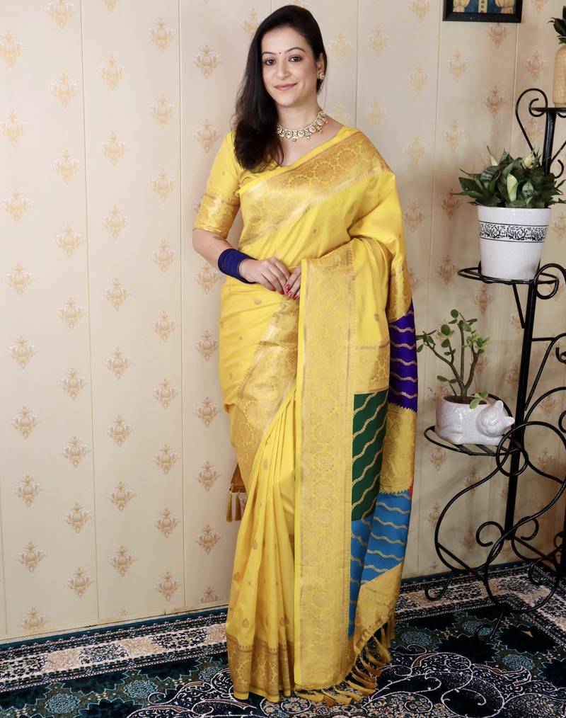 Yellow banarasi silk zari weaving saree with matching blouse piece