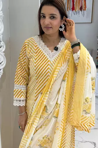 Beautiful yellow cotton kurta set with blue floral strippedroidery