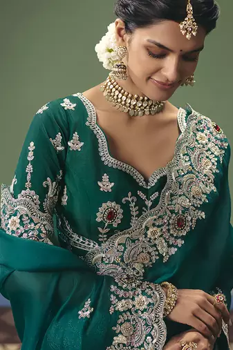Teal fancy fabric embroidered saree
