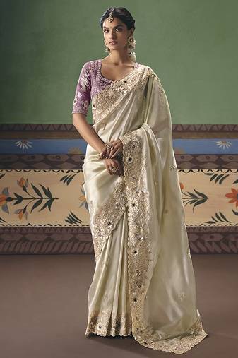 Cream fancy fabric embroidered saree