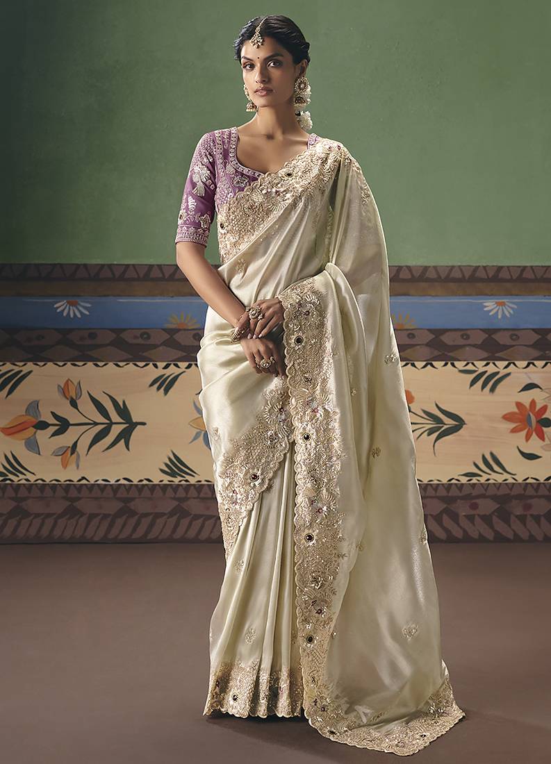 Cream fancy fabric embroidered saree