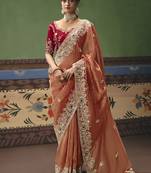 Coral fancy fabric embroidered saree