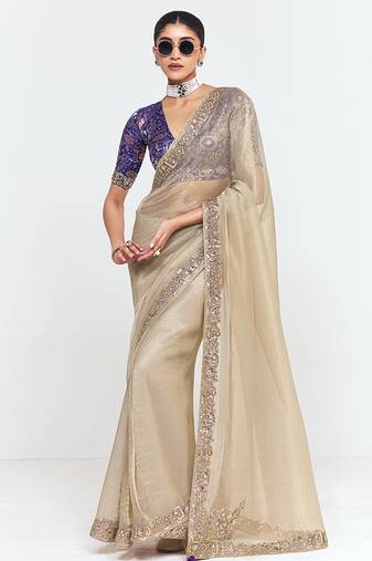 Fancy fabric embroidered beige saree