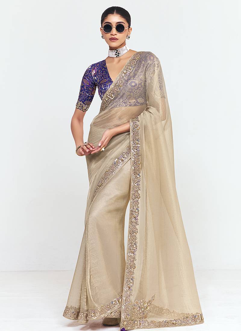 Fancy fabric embroidered beige saree