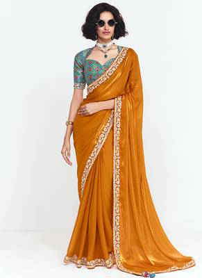 Fancy fabric embroidered orange saree 1