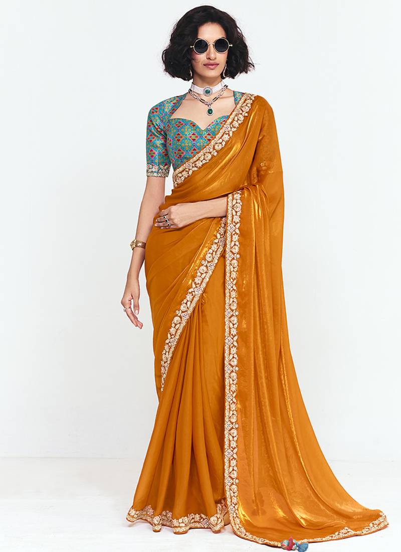 Fancy fabric embroidered orange saree