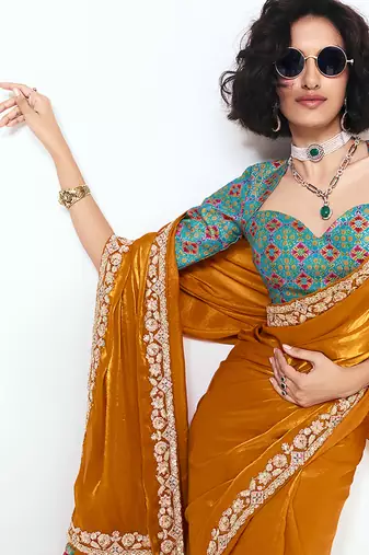 Fancy fabric embroidered orange saree