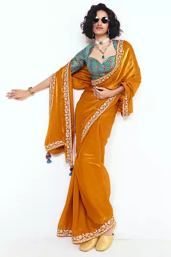 Fancy fabric embroidered orange saree