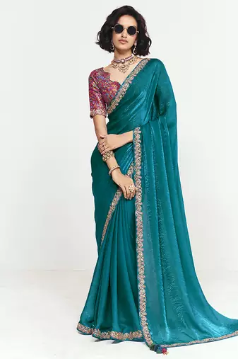 Fancy fabric embroidered teal saree