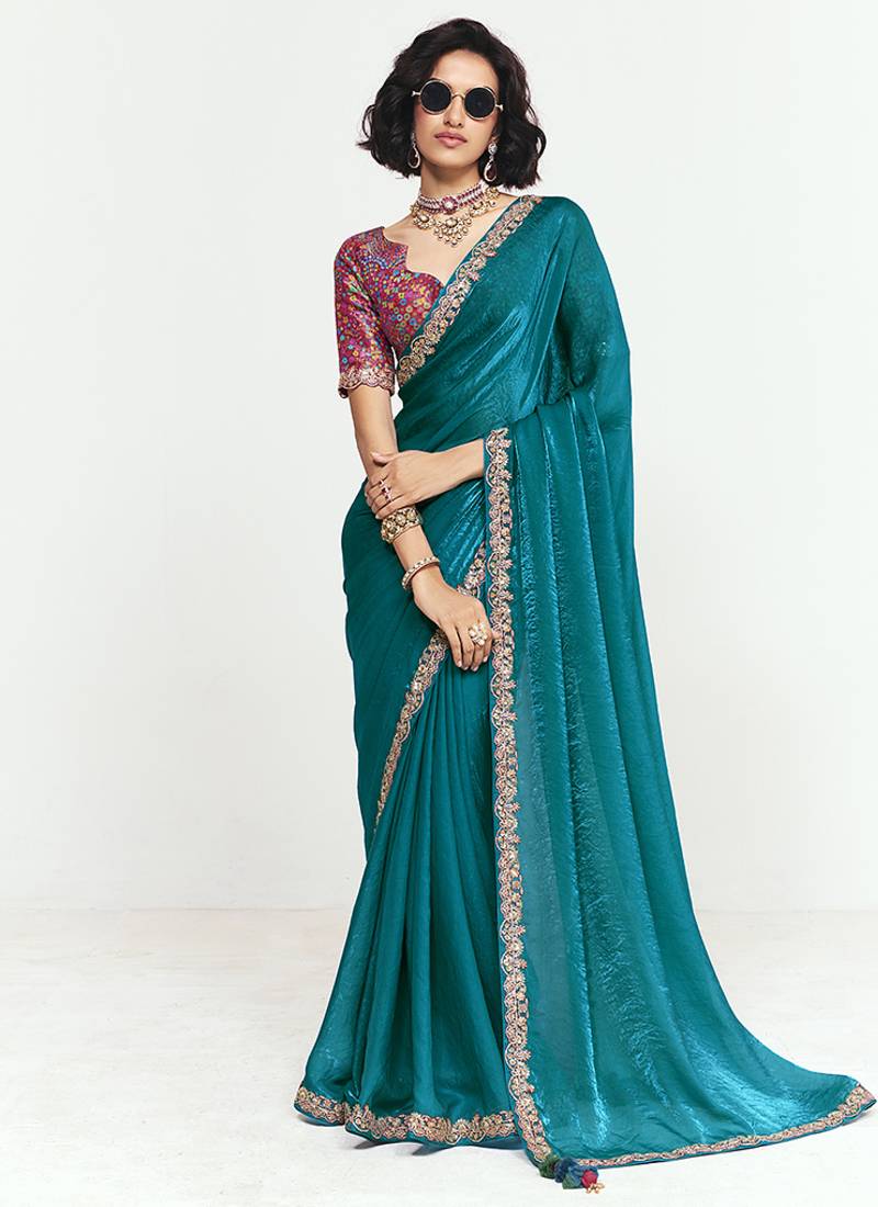 Fancy fabric embroidered teal saree