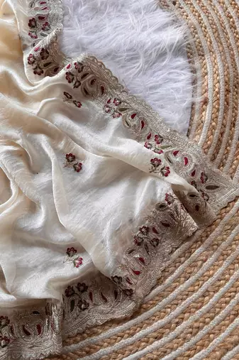 cream shimmer silk embroidered saree with red blouse