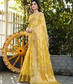 yellow organza silk saree with floral woven border