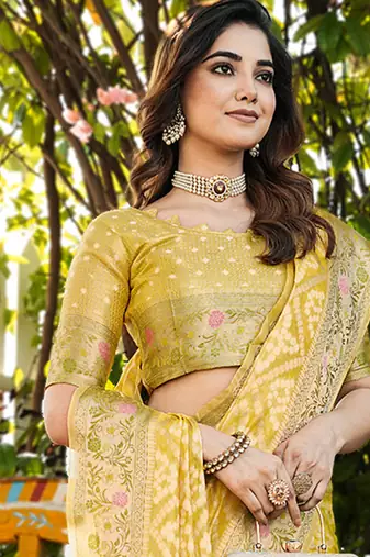 yellow organza silk saree with floral woven border