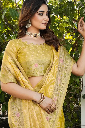 yellow organza silk saree with floral woven border