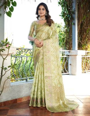 green organza silk saree with bandhani patola weaves 1