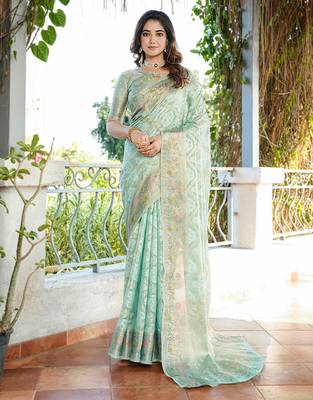 sea green organza silk saree with bandhani patola weaves 1