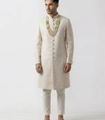 white silk sherwani with detailed hand embroidery