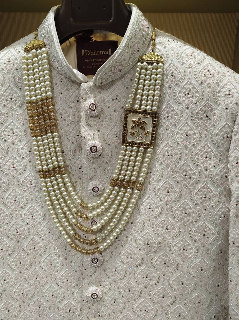 white silk sherwani with detailed hand embroidery